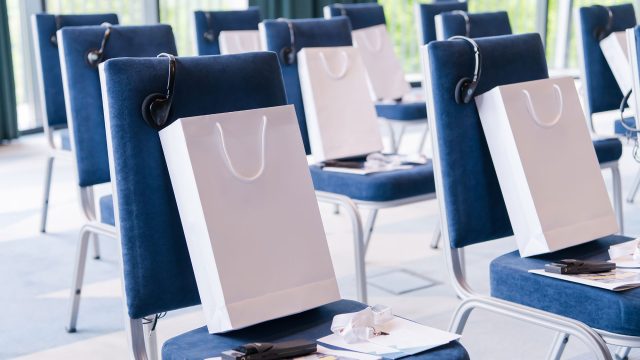 Corporate Gifts on Chairs for Guests at a Conference