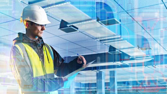 Man Inspecting HVAC Ventilation System