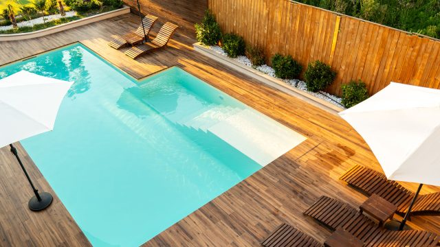 Modern Turquoise Swimming Pool with Wooden Deck