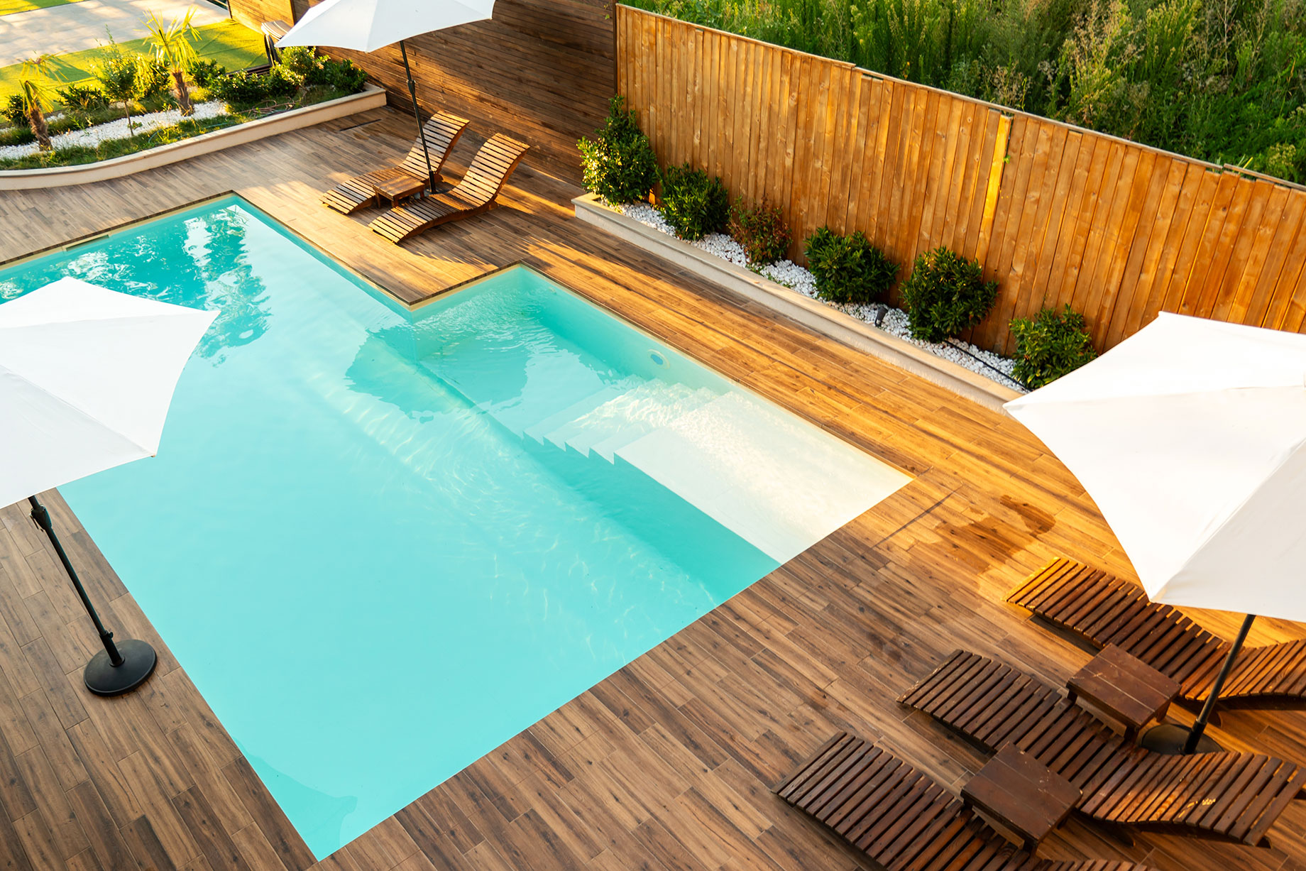 Modern Turquoise Swimming Pool with Wooden Deck