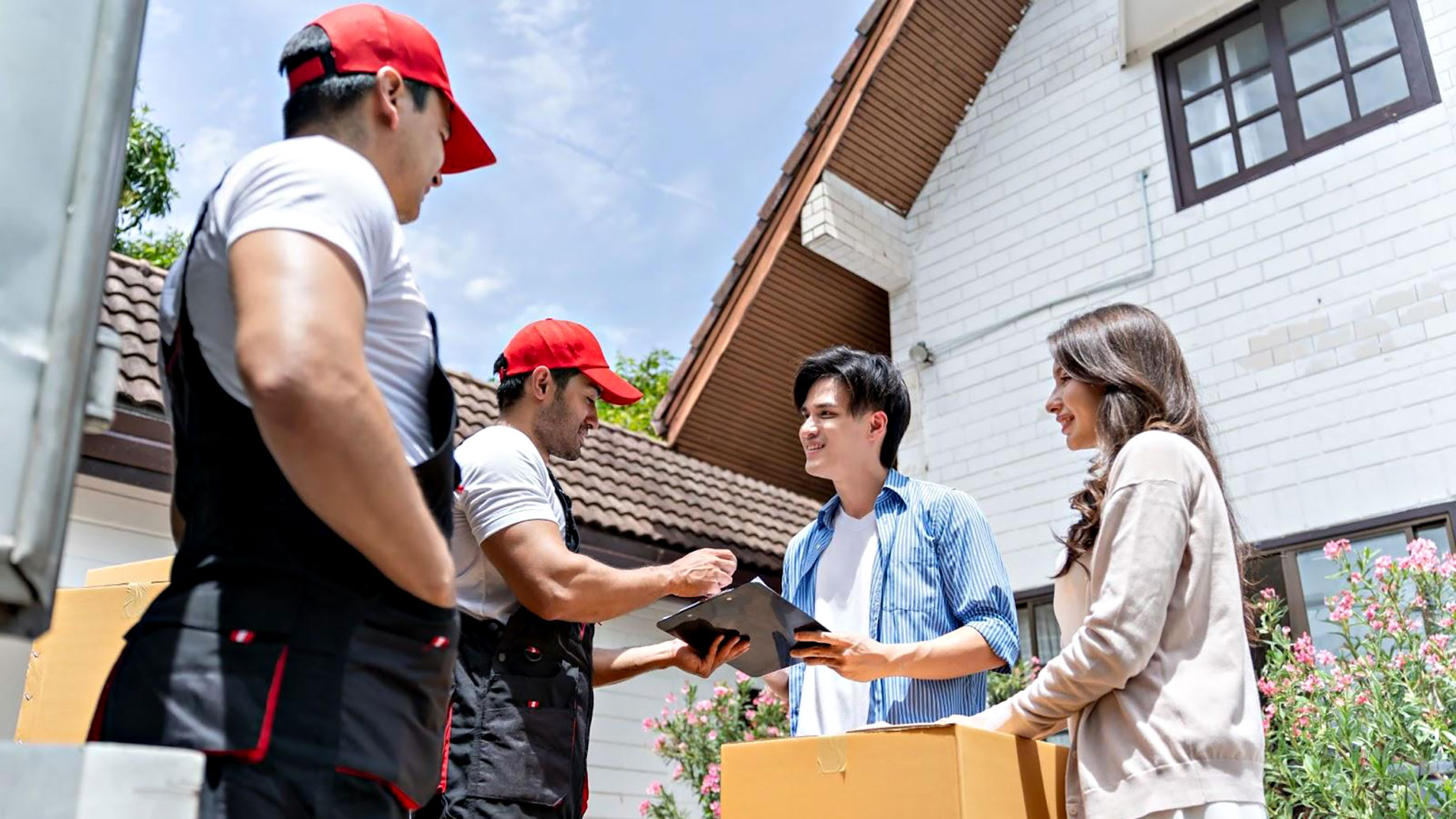 Professional Movers Helping a Young Couple Move