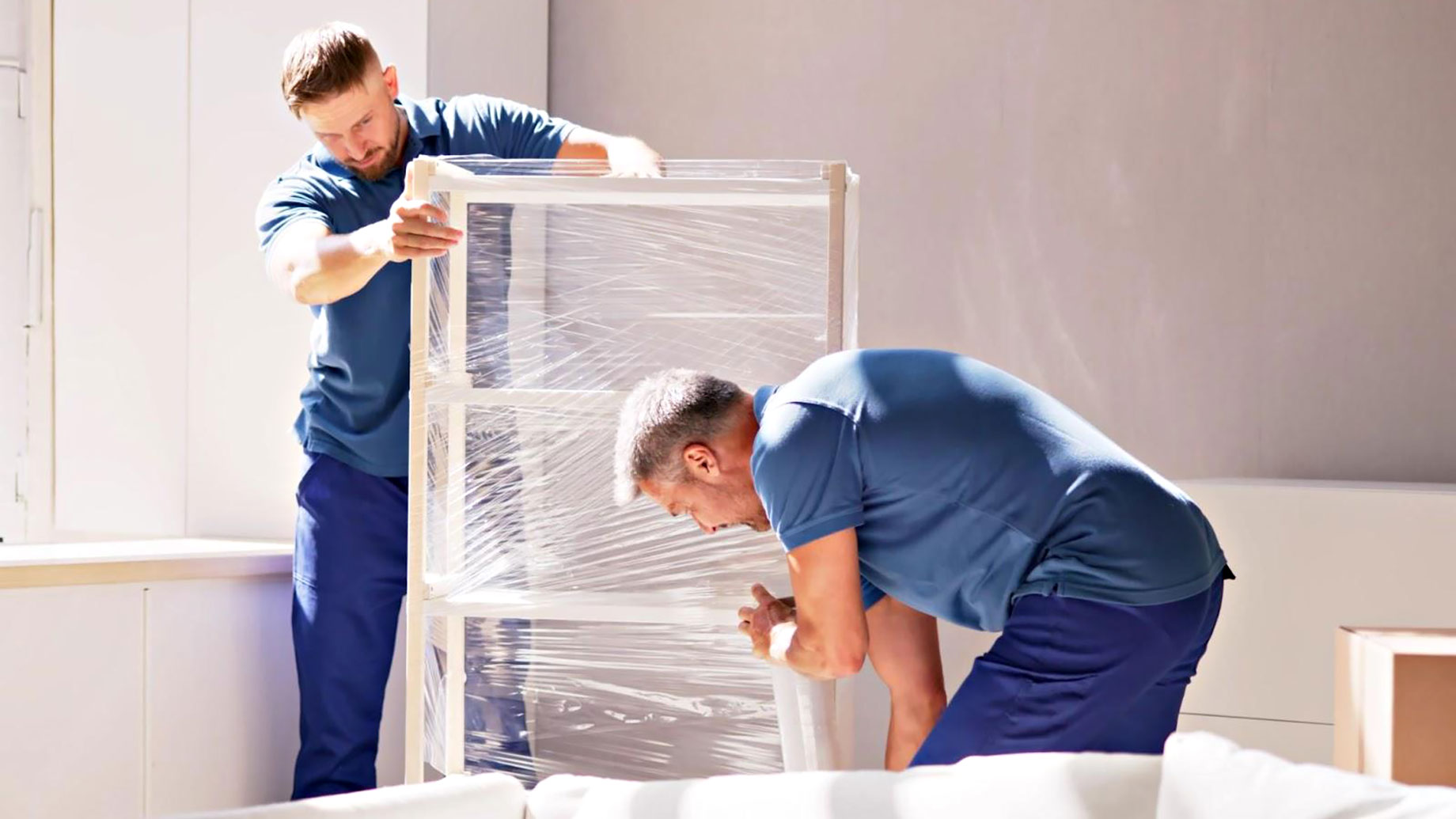 Professional Movers Packing Furniture for a Move
