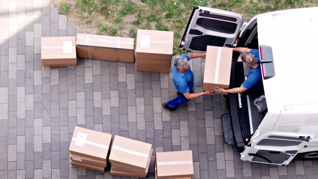 Professional Movers Packing Truck with Boxes