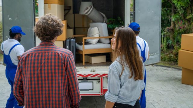 Professional Movers Packing the Truck for a Couple Moving
