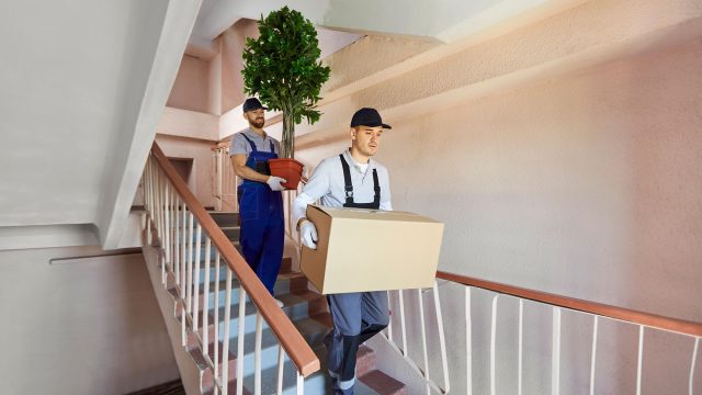 Professional Movers Taking Furniture Out