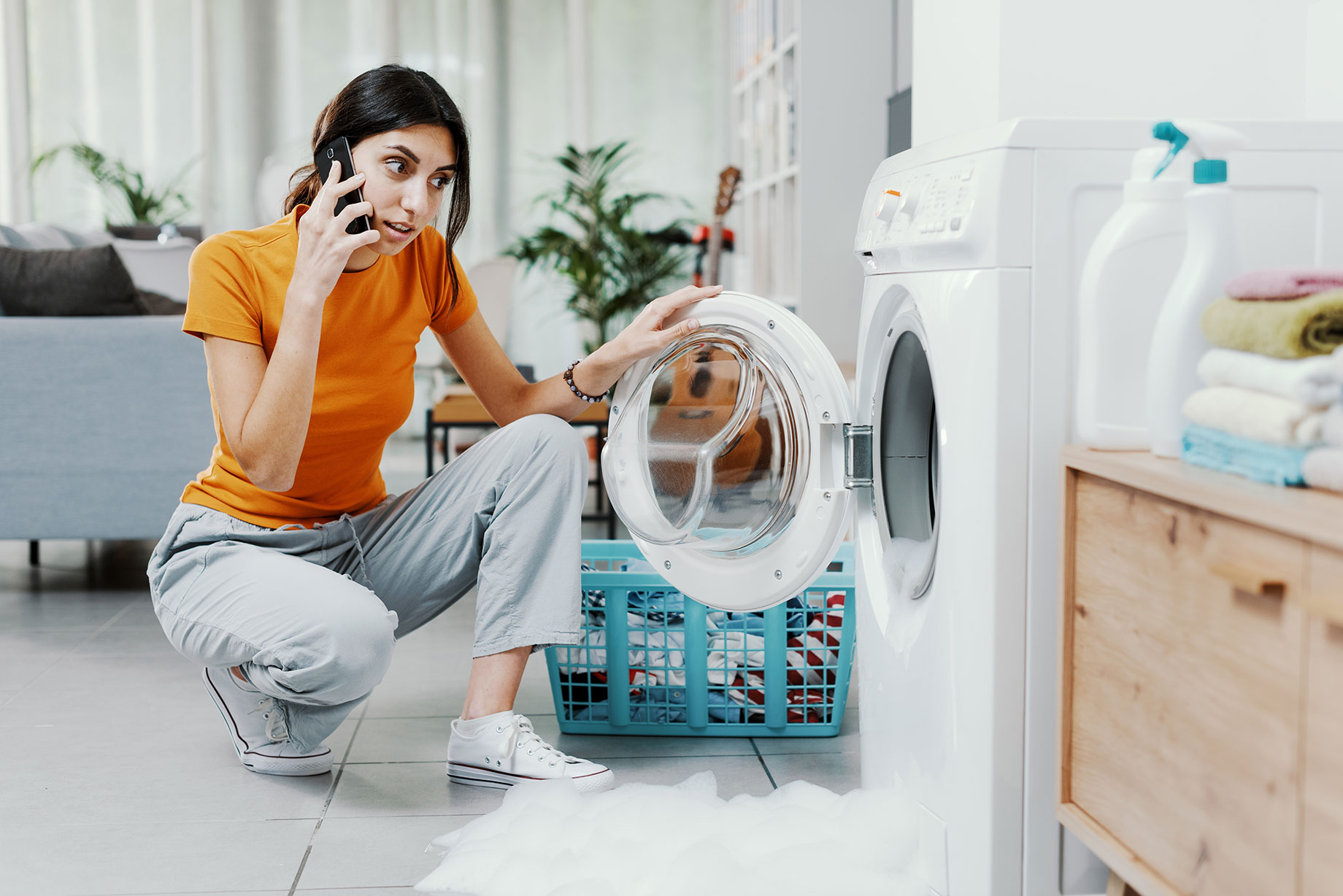 Woman on the Phone with a Technician to Troubleshoot Washing Machine