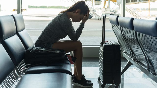 Woman Upset at the Airport About Missing Her Flight