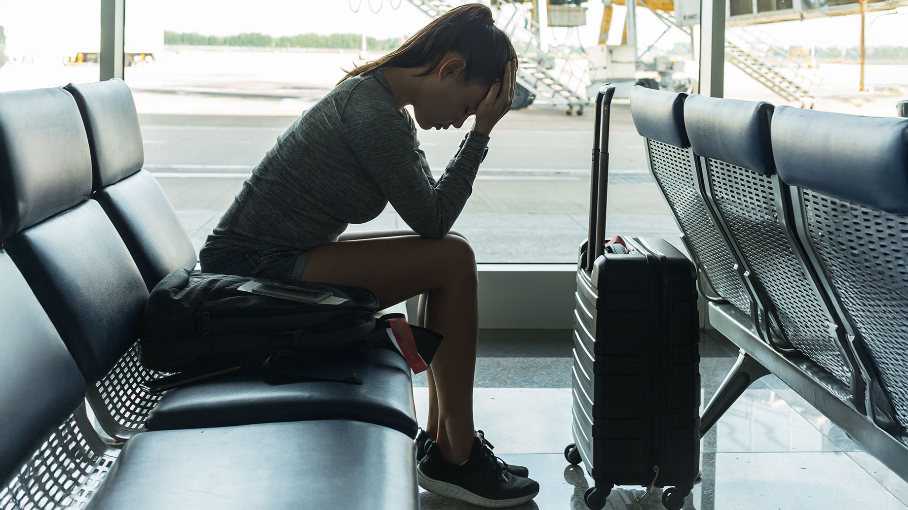 Woman Upset at the Airport About Missing Her Flight
