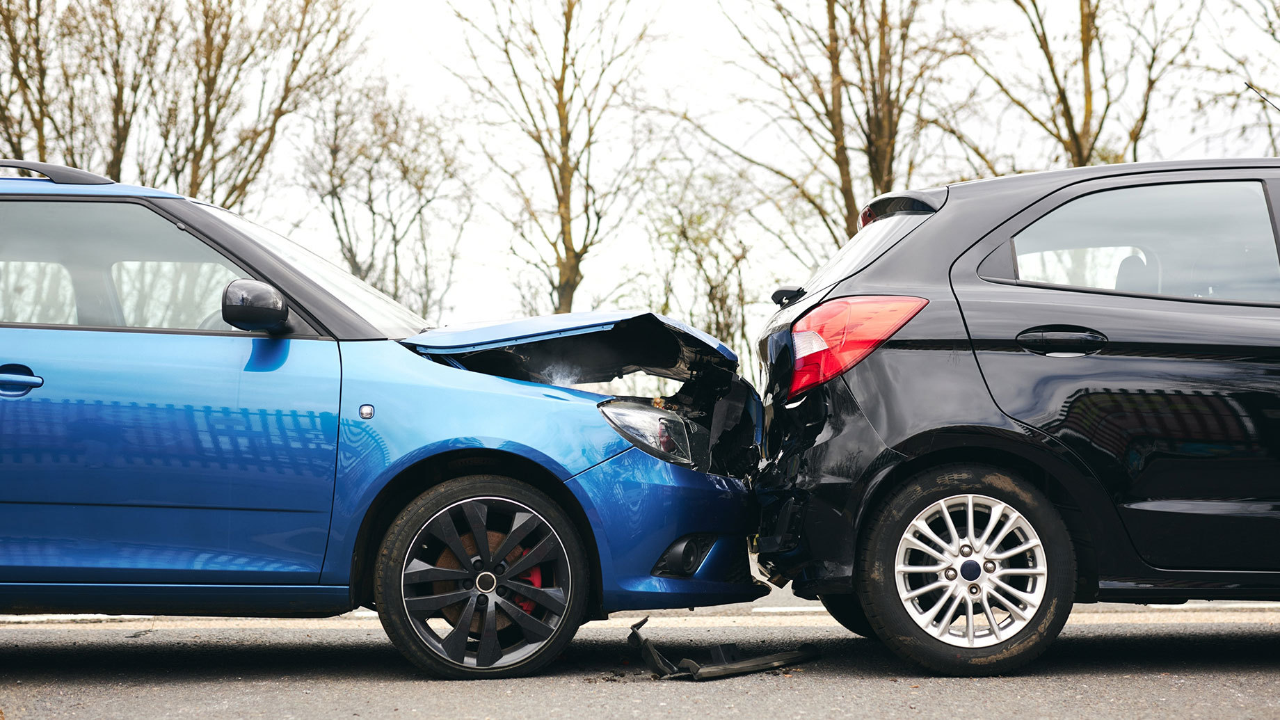 Black Car Rear-Ended by a Blue Car