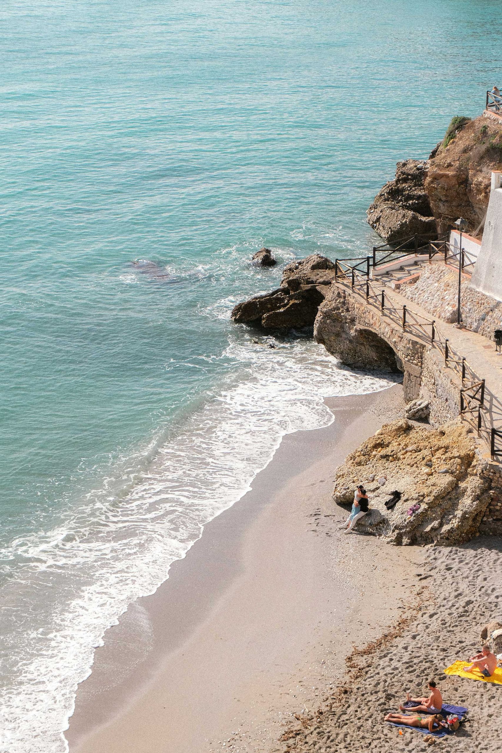 Beach with Turquoise Water and Rocky Cliffs - Nerja, Spain