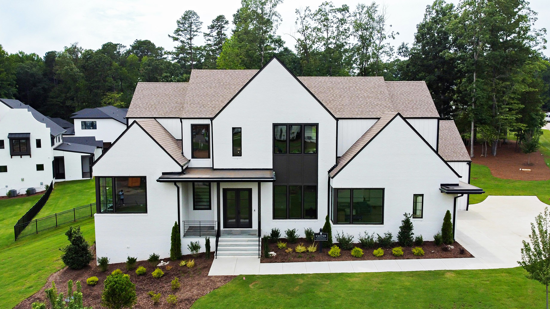 Modern Contemporary White House with Lush Landscaping