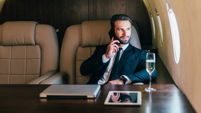 Businessman Flying on His Private Jet