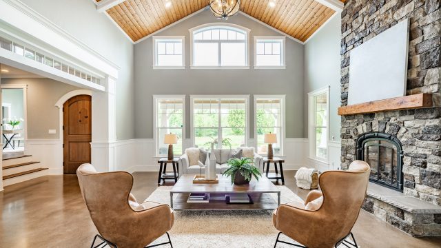 Living Room Interior with Vaulted Ceiling and a Wood Cedar Panelling Stone Fireplace