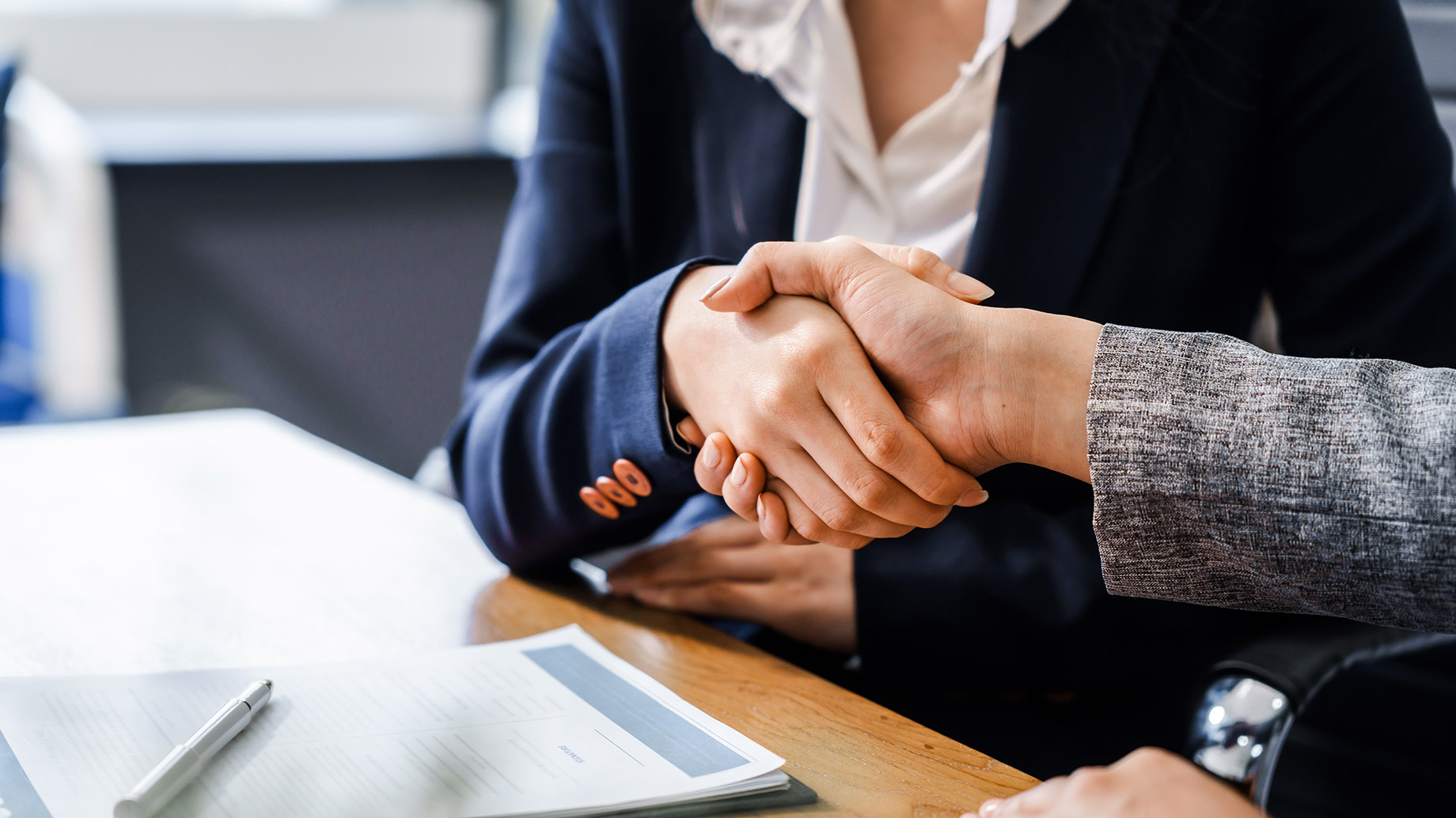 Two Female Lawyers Shaking Hands