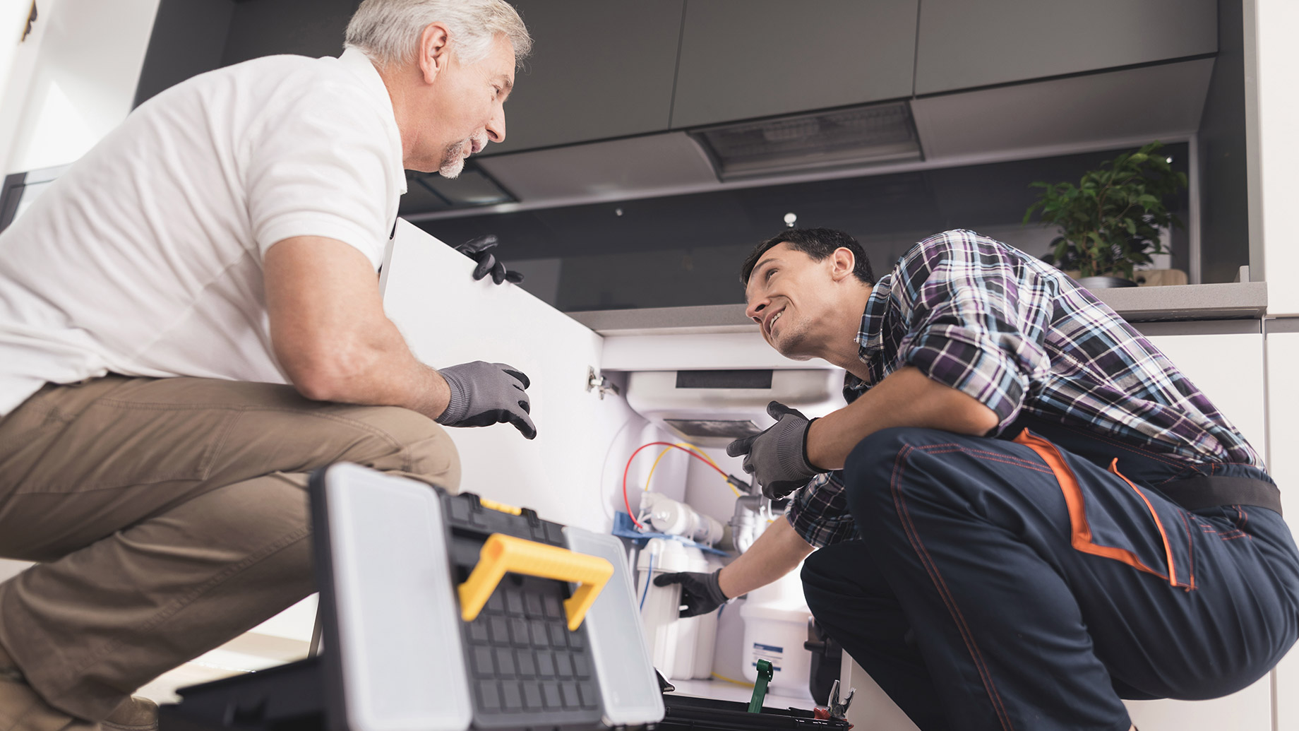 Two Plumbers Are Prepared to Repair the Water Filter