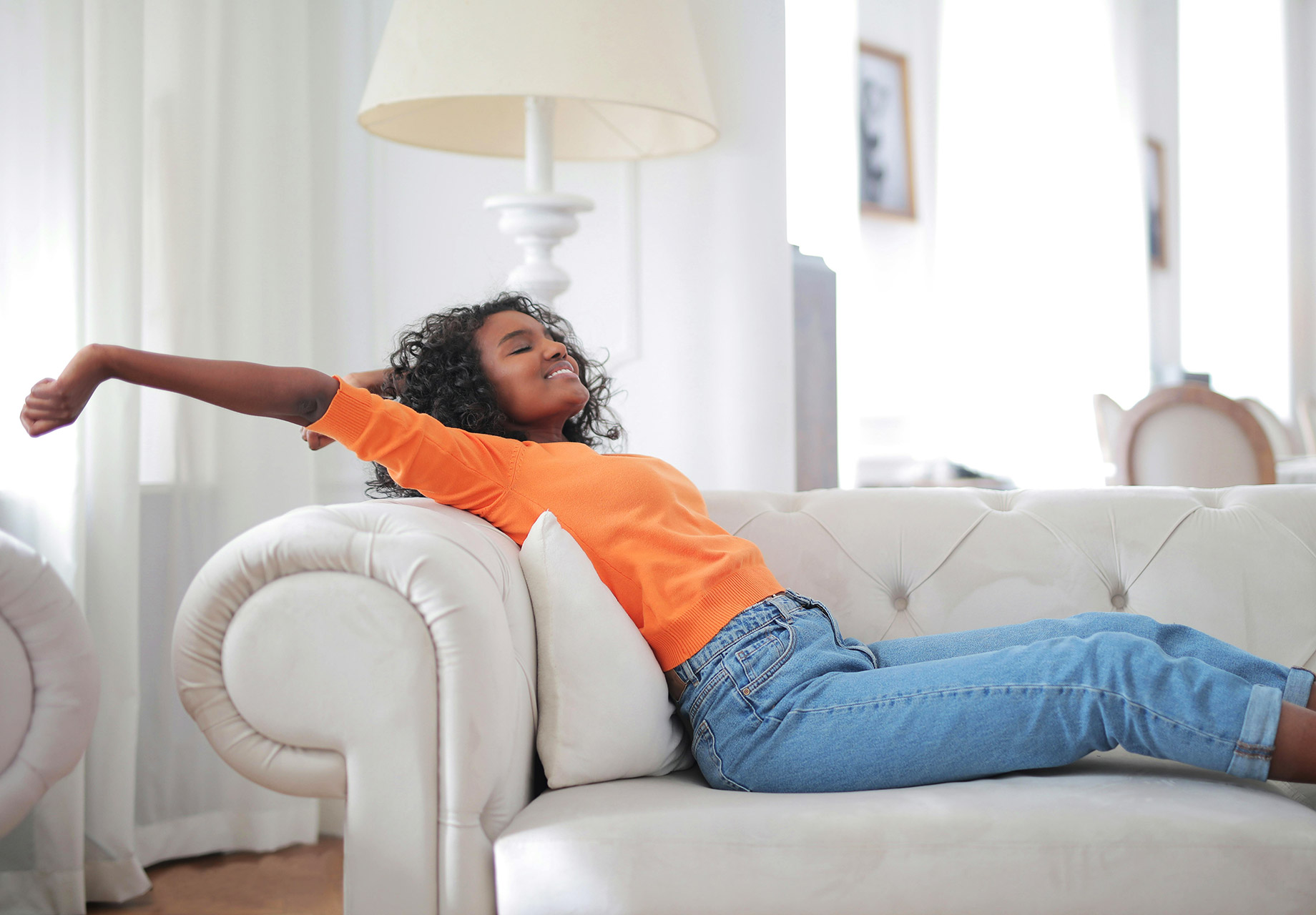 Woman Enjoying Her Home, Relaxing on Sofa