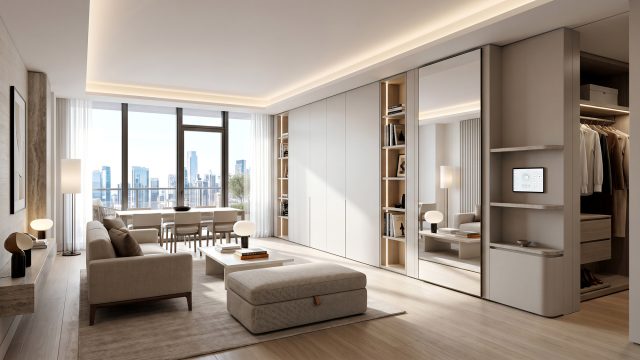 A bright, minimalist luxury apartment living area featuring custom built-in storage, neutral-toned furniture, a smart home wall panel, and floor-to-ceiling windows with a city skyline view.