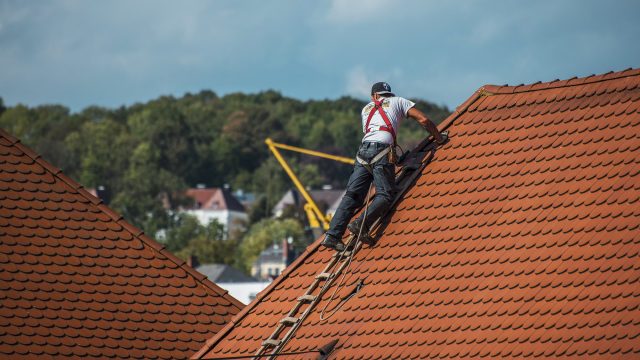 Professional Roofer at Work