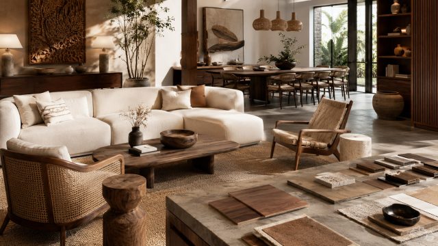 Elegant organic-modern living and dining space with handcrafted wood furniture, woven chairs, natural textures, and refined neutral styling.