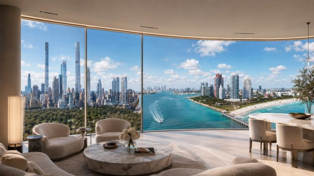 Luxury penthouse interior with floor-to-ceiling windows blending Manhattan’s Billionaires’ Row skyline on the left with Biscayne Bay and Miami’s waterfront on the right.
