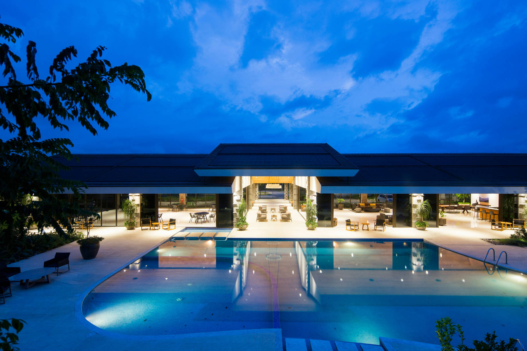 Luxury Modern Waterfront Mansion With Pool at Dusk