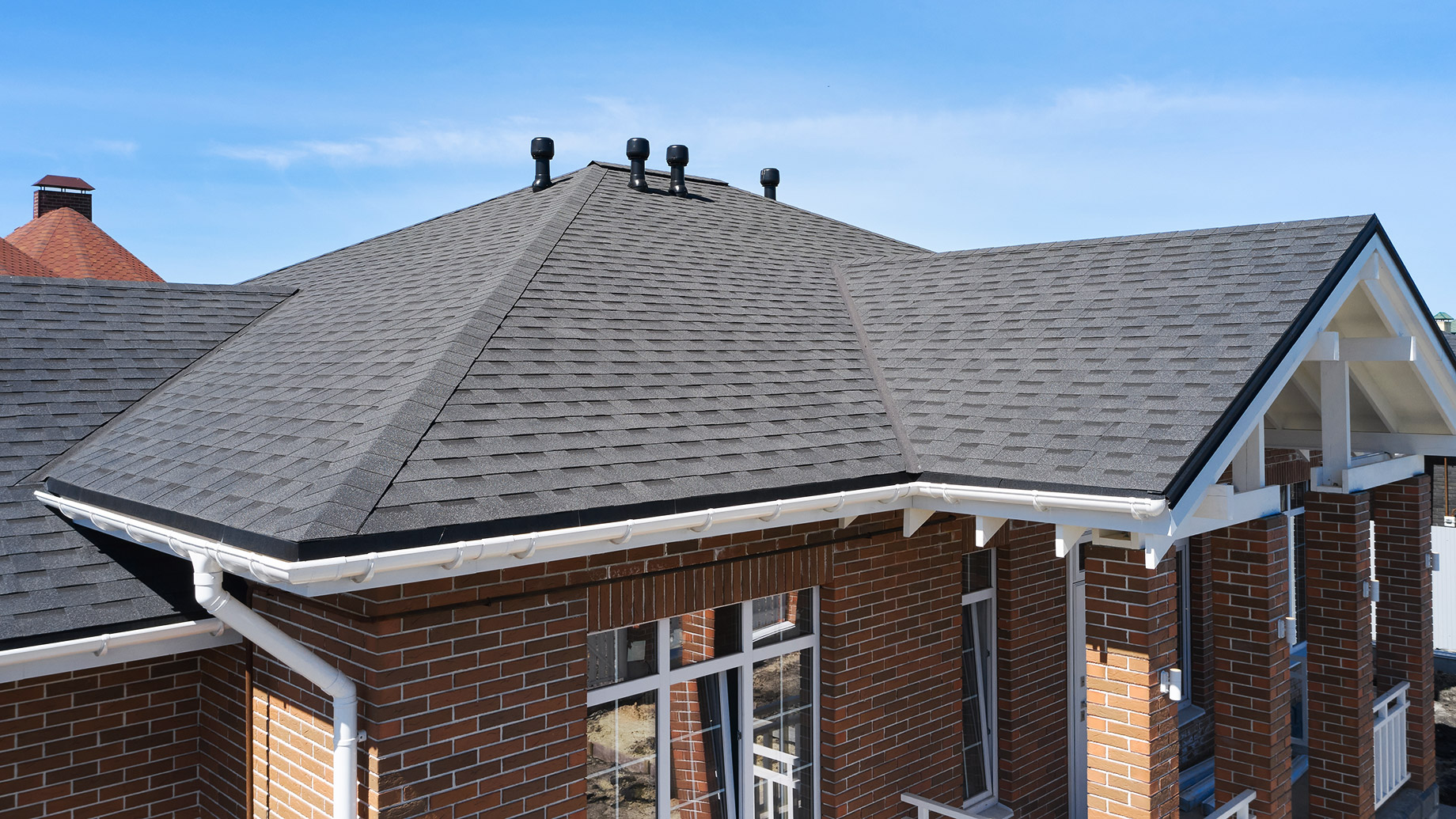 Brick House Roof With Asphalt Shingles