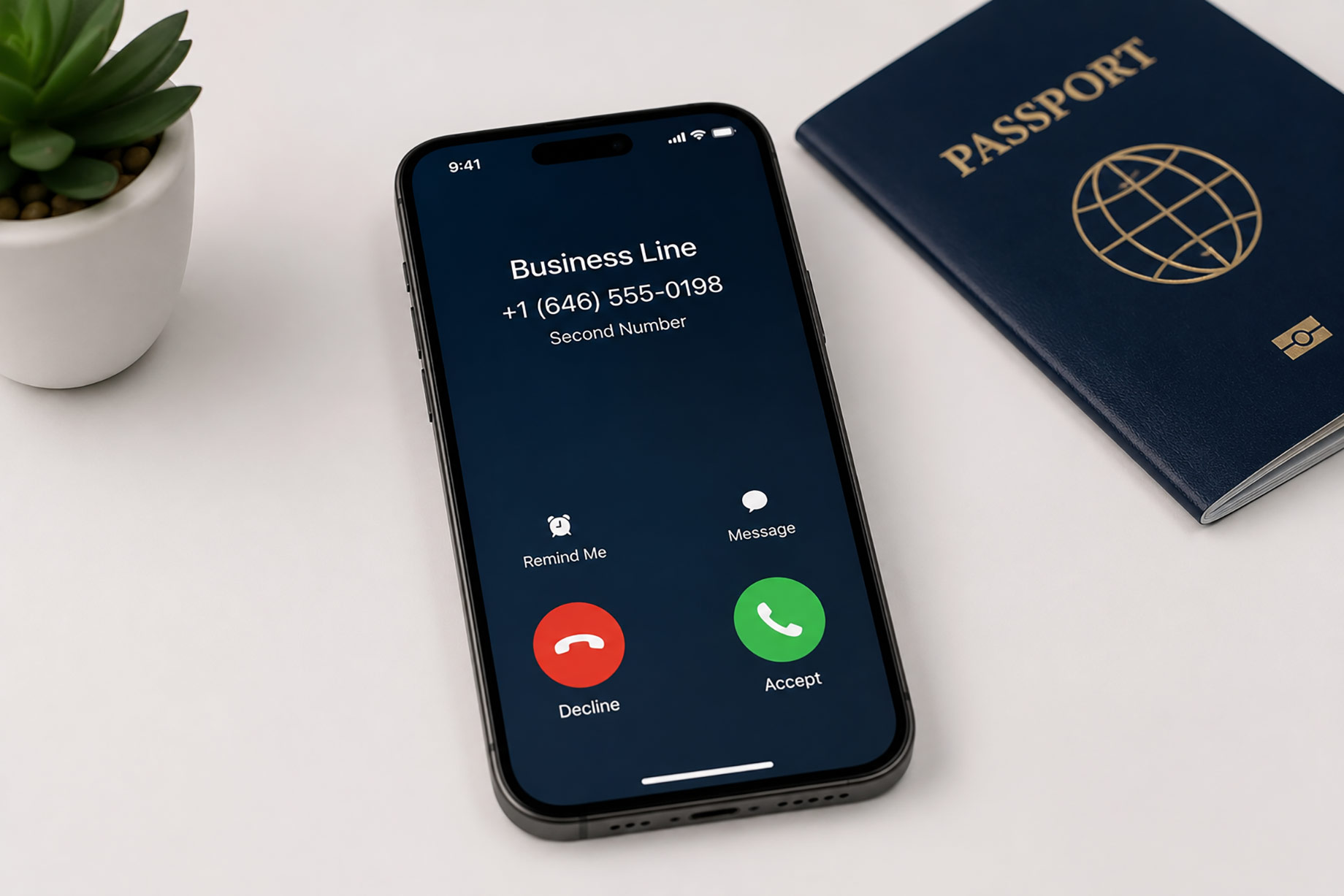 Smartphone displaying an incoming call through a dedicated business line beside a passport on a clean travel workspace.