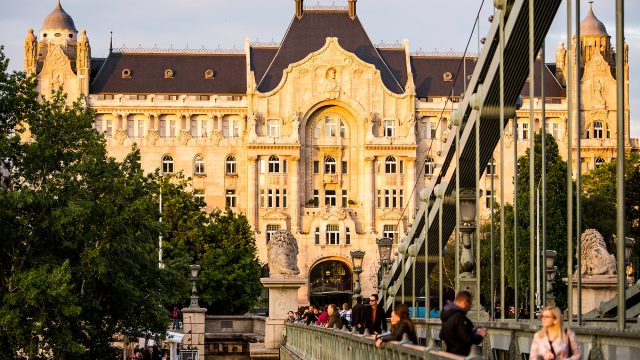 Four Seasons Hotel Gresham Palace beside the Chain Bridge in central Budapest, Hungary, during warm sunset light.