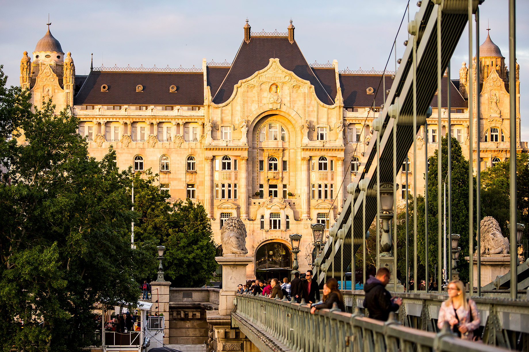 Four Seasons Hotel Gresham Palace beside the Chain Bridge in central Budapest, Hungary, during warm sunset light.