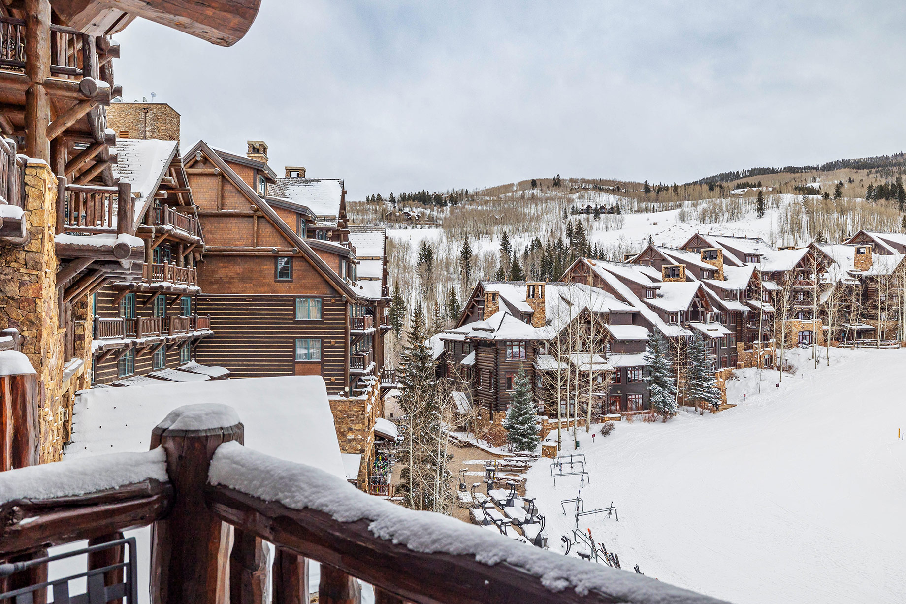 Snow-covered Ritz-Carlton Bachelor Gulch lodge beside a ski slope in Beaver Creek, Colorado.