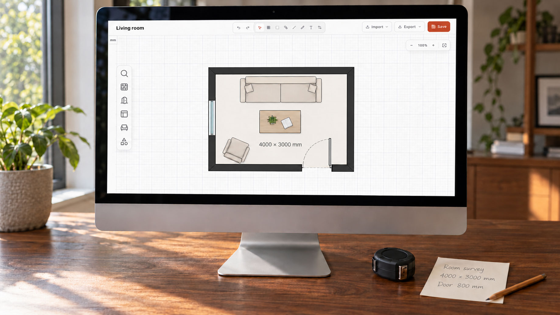 iMac displaying a furnished living room floor plan beside a tape measure, pencil and handwritten survey notes on a walnut desk.