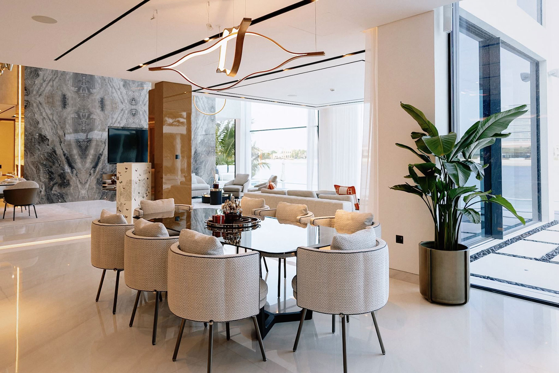 Dining area with sea views inside a Palm Jumeirah frond villa, Dubai.